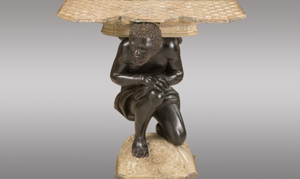 Console <br/>with a carved figure of Blackamoor<br/>and topped with silvered copper